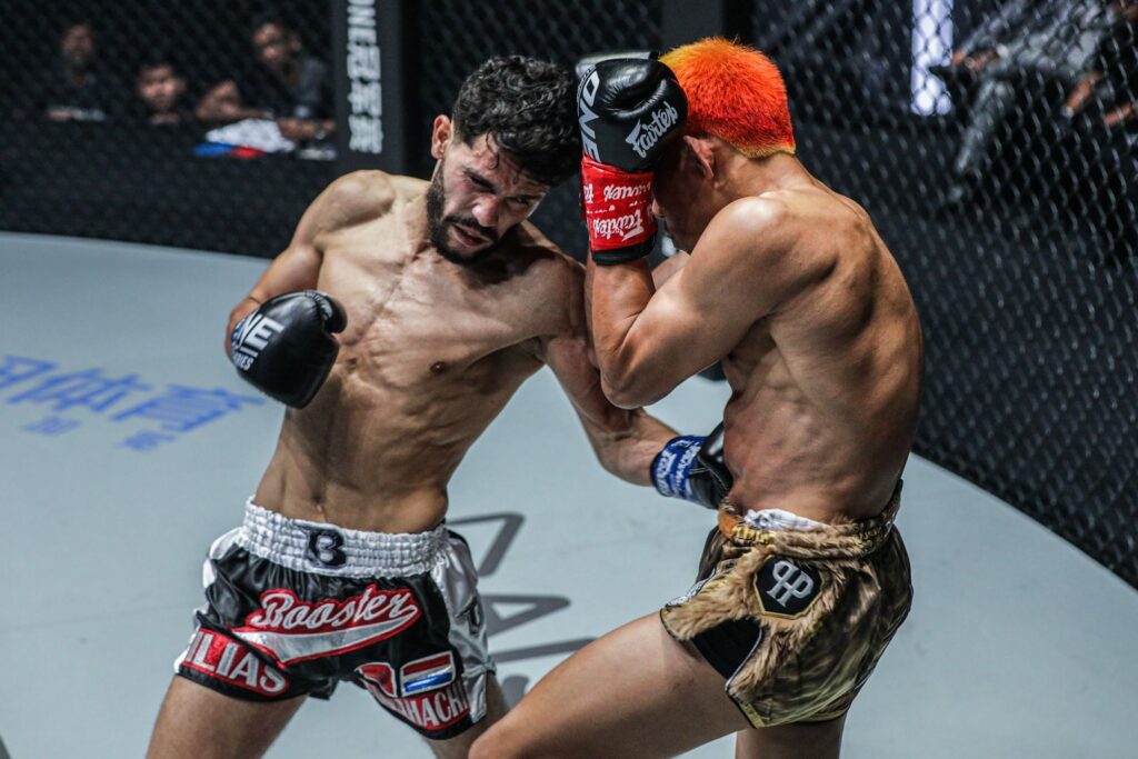 Kickboxer throws a hook at his opponent.