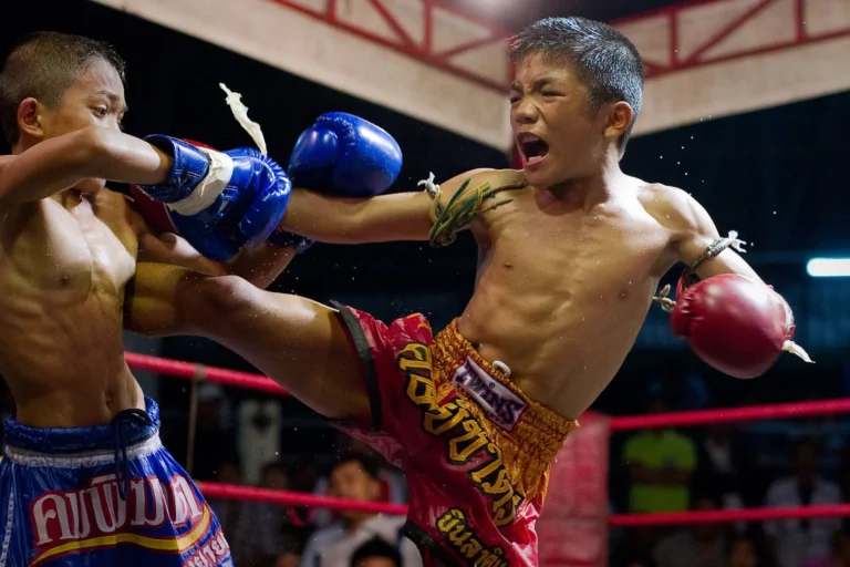 Young fighter throws a kick