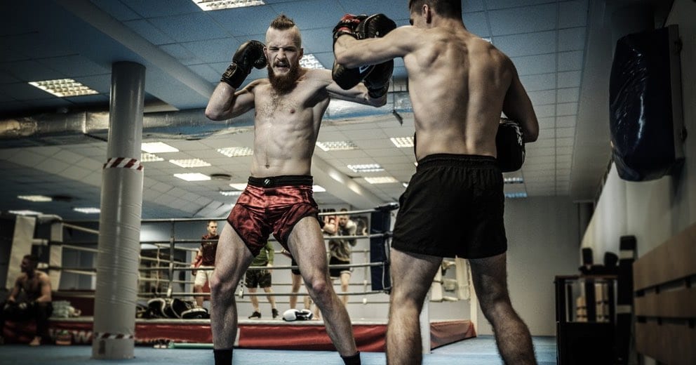 Fighters throws a left hook punch during a pad session.