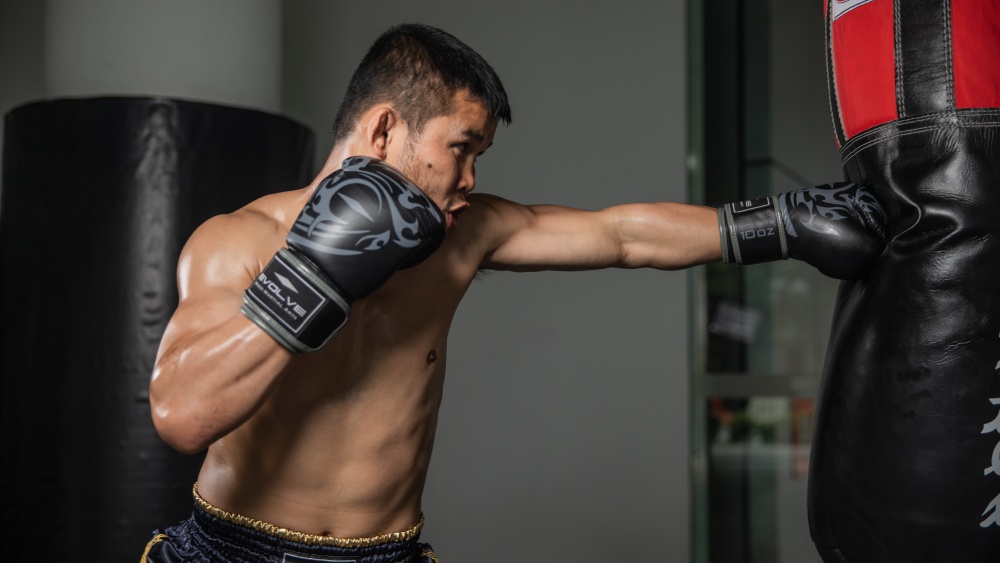 Nongo-o Throws a jab punch on the heavy bag